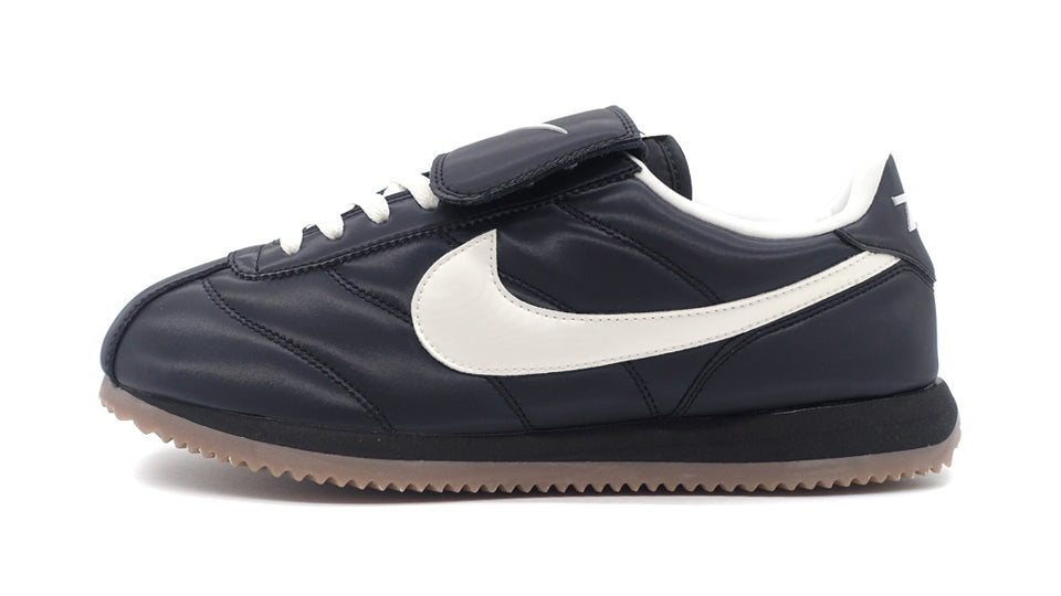 NIKE CORTEZ SE BLACK/SAIL/GUM DARK BROWN/METALLIC DARK GREY