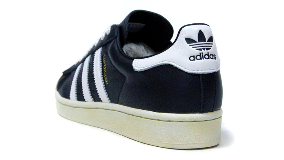 Adidas superstar on sale black navy