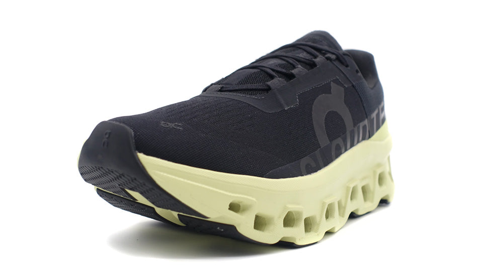 On CLOUDMONSTER BLACK/ACACIA 1